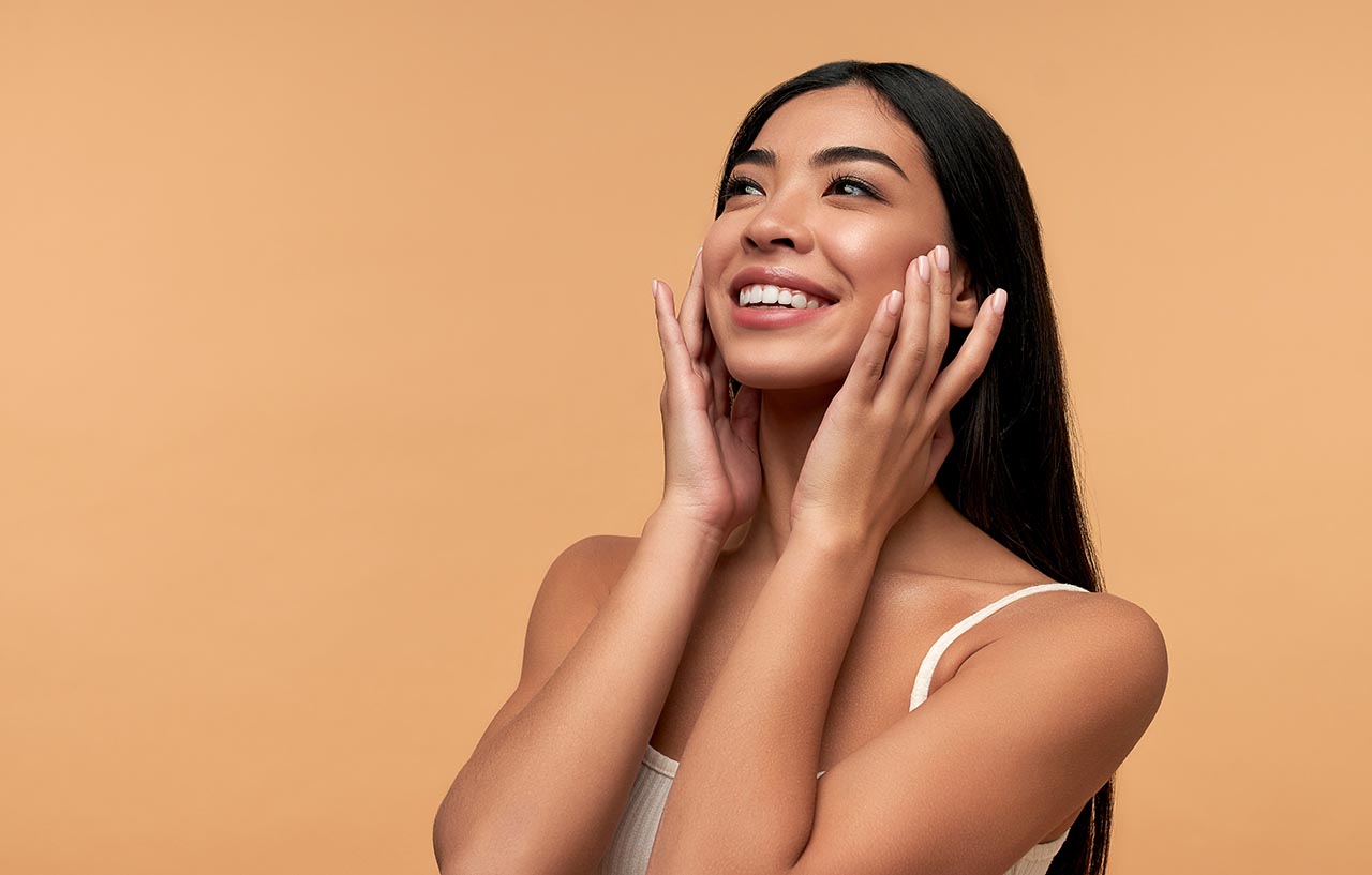 Young woman glowing with confidence after learning about plastic surgery financing options Young woman glowing with confidence after learning about plastic surgery financing options